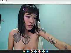 Petite rocker babe strips naked on cam