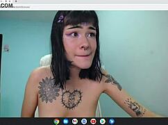 Petite rocker babe strips naked on cam