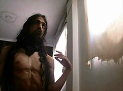 bearded lady teases with feet and cock