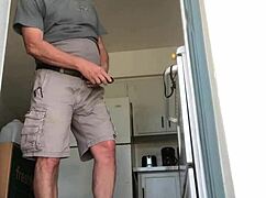 Mature shaved amateur intensely jacks off his cock at the door