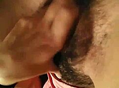 The prostitute is masturbating herself in this steamy scene