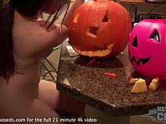 hot teen carves pumpkin then fucks it on the sofa