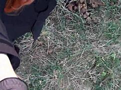 Redhead In Mask And Boots Outdoors