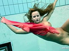 Silvie swims in bikini, reveals hairy pussy.