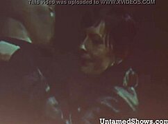 blonde dancer performs striptease on stage