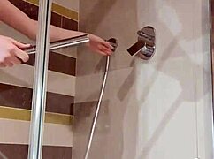 Bitch teases herself in the shower with a dildo, sucking and fucking.