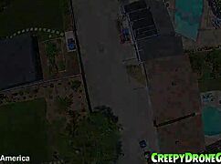 Lesbians are filmed by a drone in the outdoor pool for amateur video