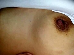 Relaxed Mother-In-Law Massage Turns Into Tit Caressing On Bed While Watching TV.