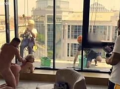 Cleaning lady surprises with unexpected actions in front of windows