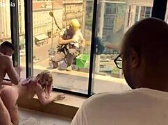 Cleaning lady surprises with unexpected actions in front of windows