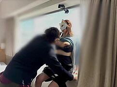 ASIAN MILF ENJOYS BLOWJOB IN GLASS-EXPOSED ROOM DURING OVERNIGHT STAY