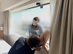 ASIAN MILF ENJOYS BLOWJOB IN GLASS-EXPOSED ROOM DURING OVERNIGHT STAY