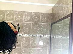 Huge tits ebony model strips costume and poses seductively for voyeur camera.