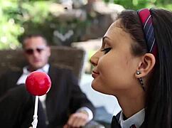 Lollipop tease performance with subtle hints.