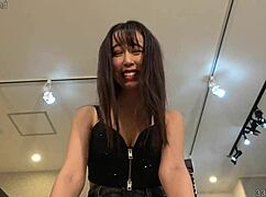 submissive man licks lily hosho while she laughs softly.