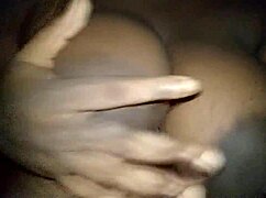 ebony woman groping her big horny tits with passion