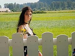 Beautiful natural milf enjoys peaceful outdoor nature and flowers. She undresses slowly in the softcore scene