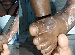 cyndy blackslave washes feet in closeup