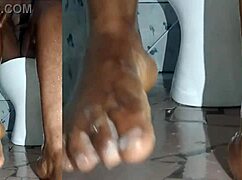 cyndy blackslave washes feet in closeup