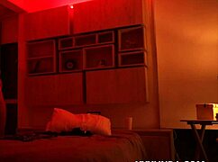 Linda Houston dances seductively under the red light with her couple