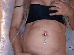 Intriguing view of hermosa travesti in crossdressing, touching her body softly