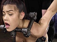 Babe's hot ass spanked in device bondage, feeling the sting