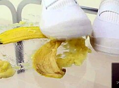 asian girl crushes banana in wild food fetish play
