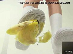 asian girl crushes banana in wild food fetish play