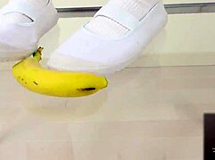 asian girl crushes banana in wild food fetish play