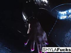 Shyla Stylez shows off big tits and ass in solo fetish smoking scene.