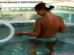 big tits model teases in bikini by the pool