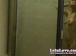 Voyeur spying zooms in on amateur brunette washing hair in steamy shower scene