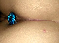 feeling the thrill of riding that monster cock in reverse cowgirl, butt plug intensifying every sensation, leading to a deep creampie.