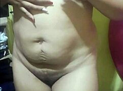 Daniela touches herself alone, fingering her milf pussy