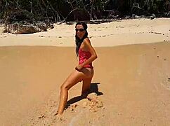 My sandy ass with red butt plug at paradise beach