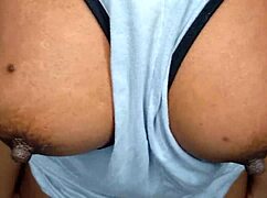 Ebony babe teases with her gorgeous tits right in your face