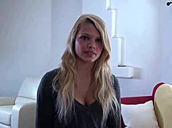 Young Taylor and her girlfriend cuddiled up, talking on a couch