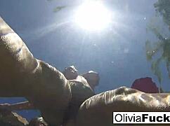 Olivia has some summer fun in the pool with blonde ass and pussy