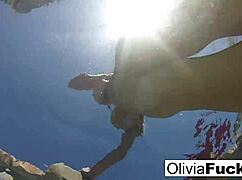 Olivia has some summer fun in the pool with blonde ass and pussy