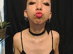 Putting on hot pink lipstick drooling