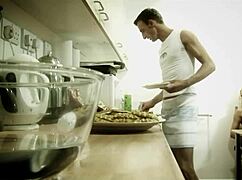 Hey, this blonde bimbo is playing with her man's dick in the kitchen until he cums! 😏