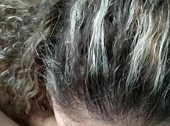 Kneeling girl sucks with big tits exposed