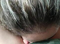 Kneeling girl sucks with big tits exposed