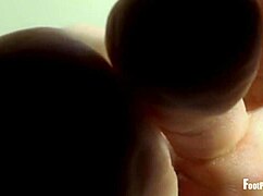 jade vixen peels off her black stockings, revealing wrinkled feet and toes