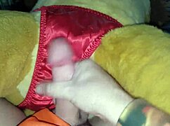 Simba's cumshot lands on satin panties in intriguing maledom scene.