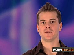 interviewer welcomes american couples for a suggestive group session