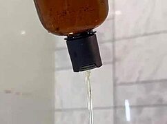 monika fox plays with pink toy in bathroom