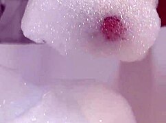 monika fox plays with pink toy in bathroom