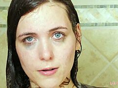 Captivating brunette teases in a steamy shower during solo photoshoot.