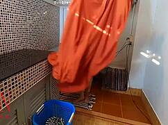 Nudist housekeeper Regina Noir jerks off in laundry
